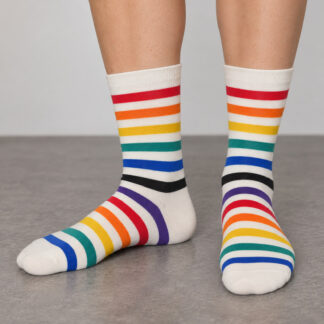 White crew socks with red, orange, yellow, green, blue, purple and black stripes, worn on both feet